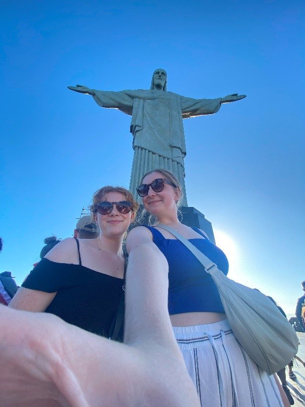 Rose and Hannah stand with the Christ the Redeemer statue in Rio de Janeiro