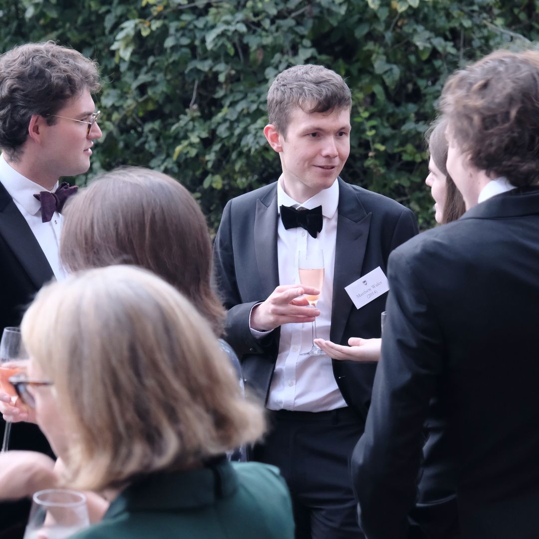 Close up of alumni and guests gather in the Fellows Garden for drinks before the THA Annual Dinner, 23 September 2023.