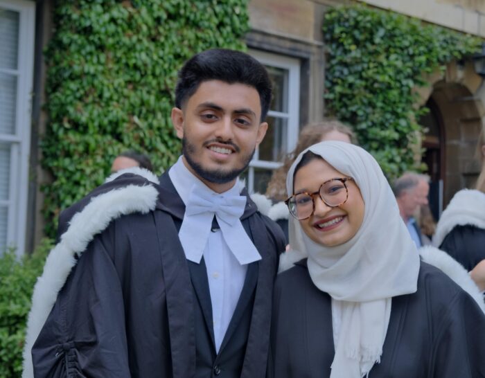 Two students at graduation in Cambridge